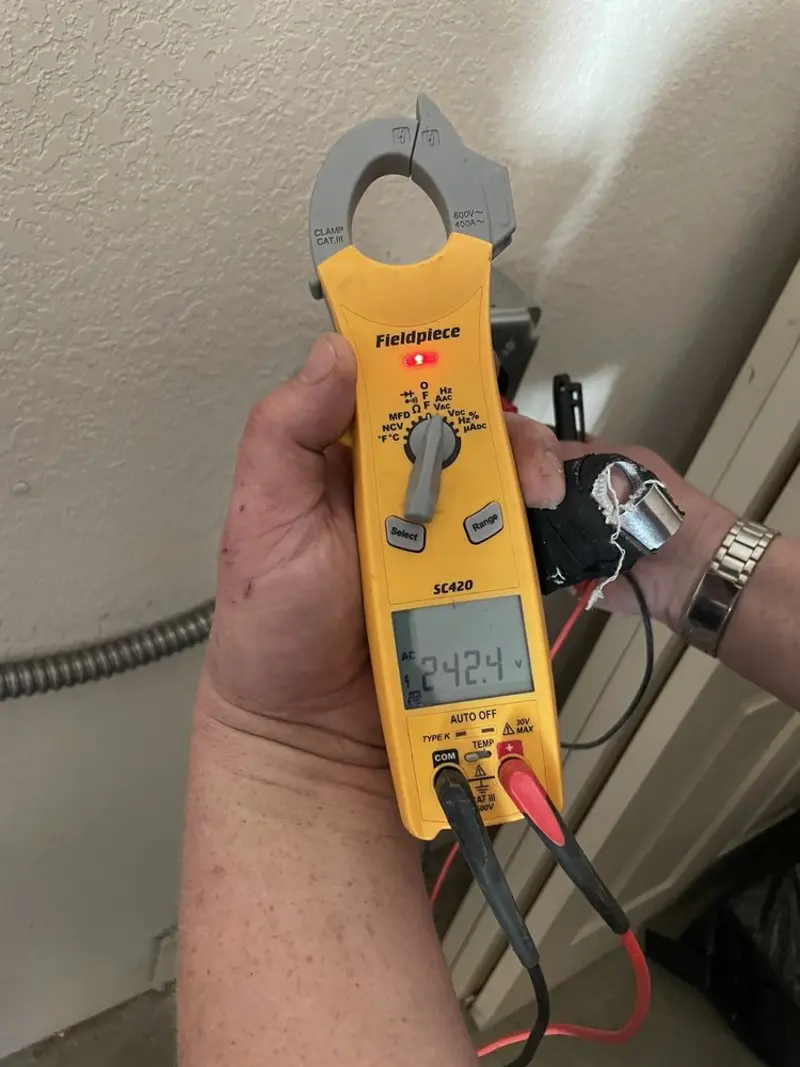 Voltage testing with clamp meter during Generator Installation in Webster